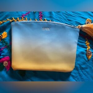 Blue ombré Ipsy cosmetic bag. Approximately 5 x 6“. Excellent condition.